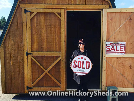 A woman happy with her new Hickory Shed