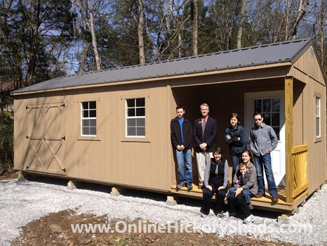 A family happy with their new Hickory Shed