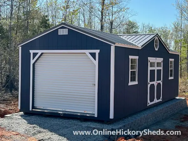 Navy Blue Utility Shed with a Roll Up Garage Door and a Gable Dormer