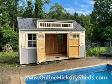 Utility Shed with a Dormer by the pool with double barn doors open